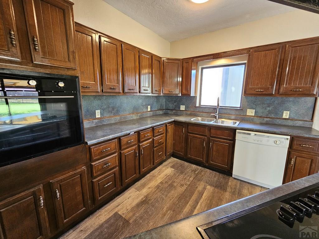 401 Park Street Springfield, CO 81073 - Photo 21 of 50 a kitchen with stainless steel appliances granite countertop a sink stove and cabinets