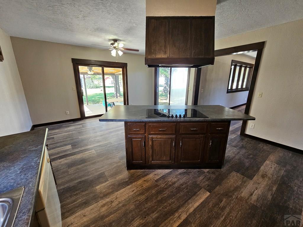 401 Park Street Springfield, CO 81073 - Photo 22 of 50 a room with granite countertop a sink and a wooden floor