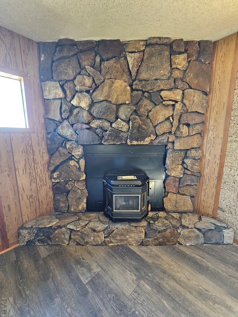 401 Park Street Springfield, CO 81073 - Photo 26 of 50 a view of a fireplace with wooden wall
