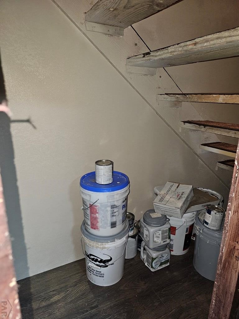 401 Park Street Springfield, CO 81073 - Photo 31 of 50 a room with water heater and wooden cabinets