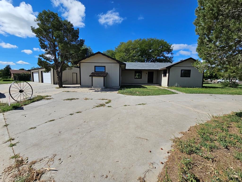 401 Park Street Springfield, CO 81073 - Photo 34 of 50 a front view of a house with a yard