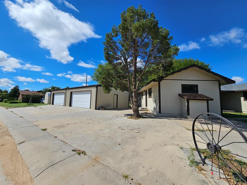 401 Park Street Springfield, CO 81073 - Photo 35 of 50 a front view of a house with table and chairs