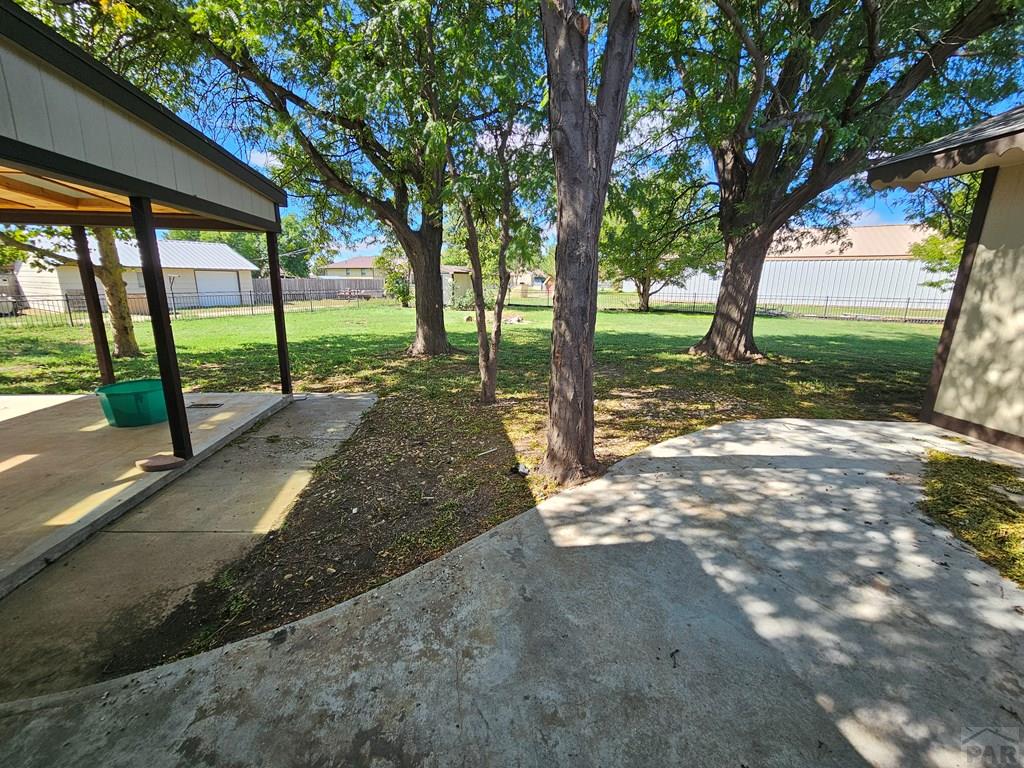 401 Park Street Springfield, CO 81073 - Photo 38 of 50 a view of a yard with a tree