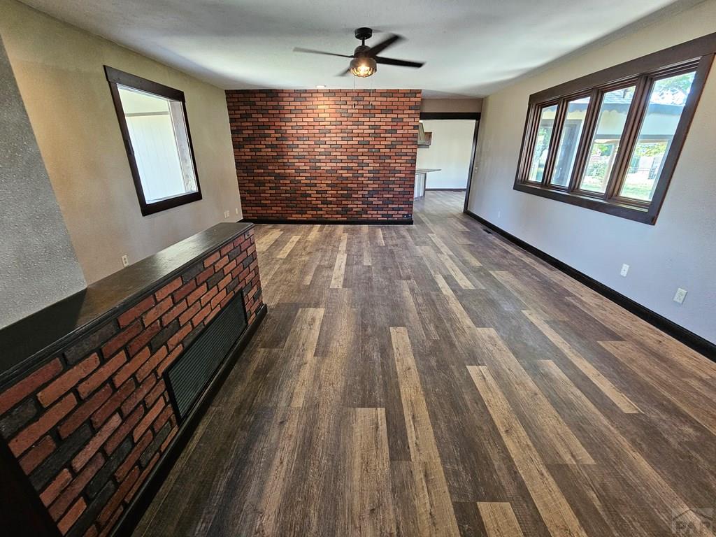 401 Park Street Springfield, CO 81073 - Photo 4 of 50 wooden floor in an empty room with a window