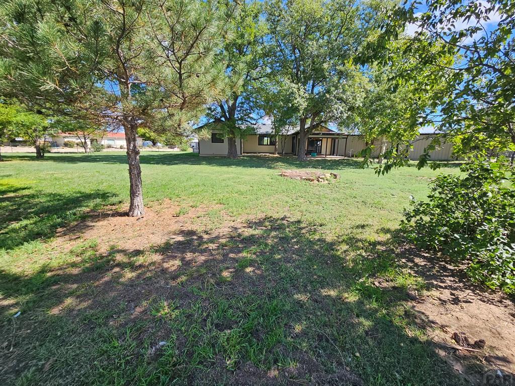 401 Park Street Springfield, CO 81073 - Photo 42 of 50 a front view of a house with a yard