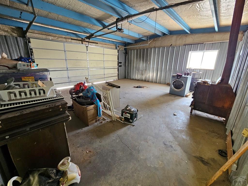 401 Park Street Springfield, CO 81073 - Photo 49 of 50 a garage with a chair and appliances