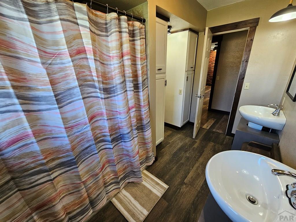 401 Park Street Springfield, CO 81073 - Photo 8 of 50 a bathroom with a sink and a mirror