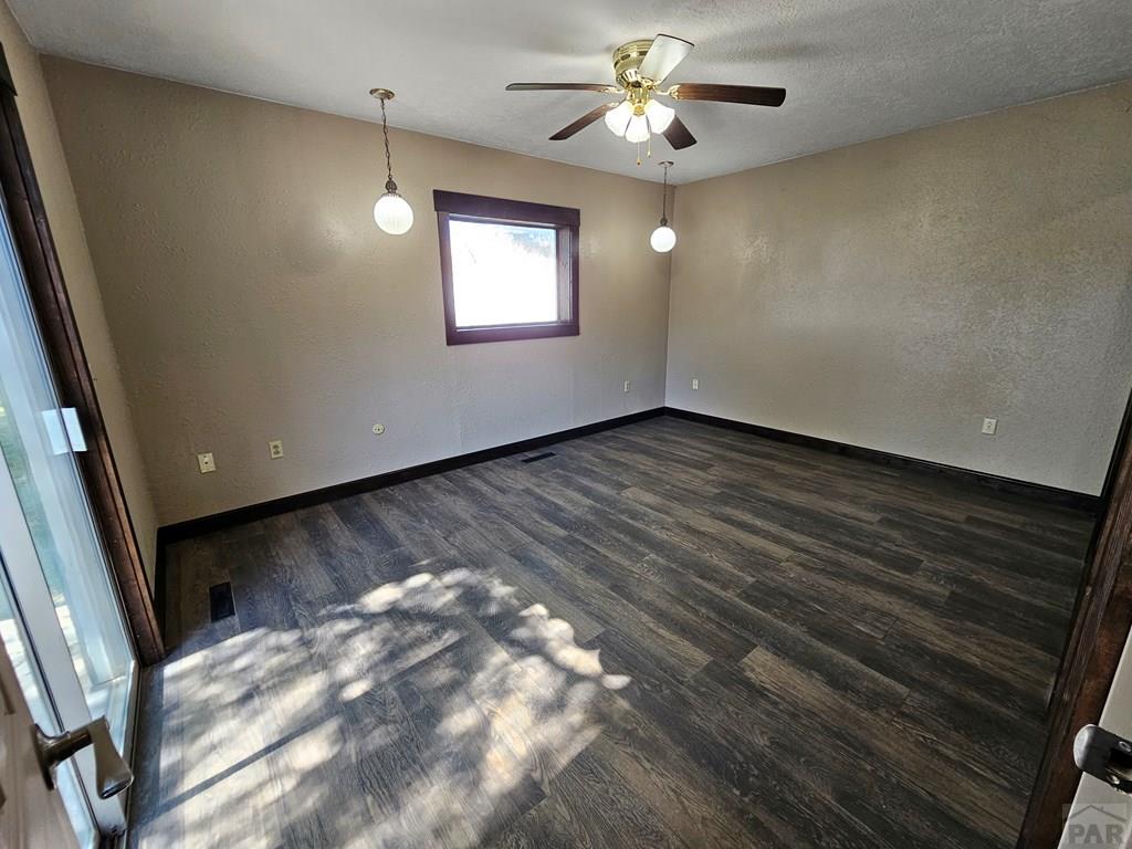 401 Park Street Springfield, CO 81073 - Photo 9 of 50 a view of an empty room with a window
