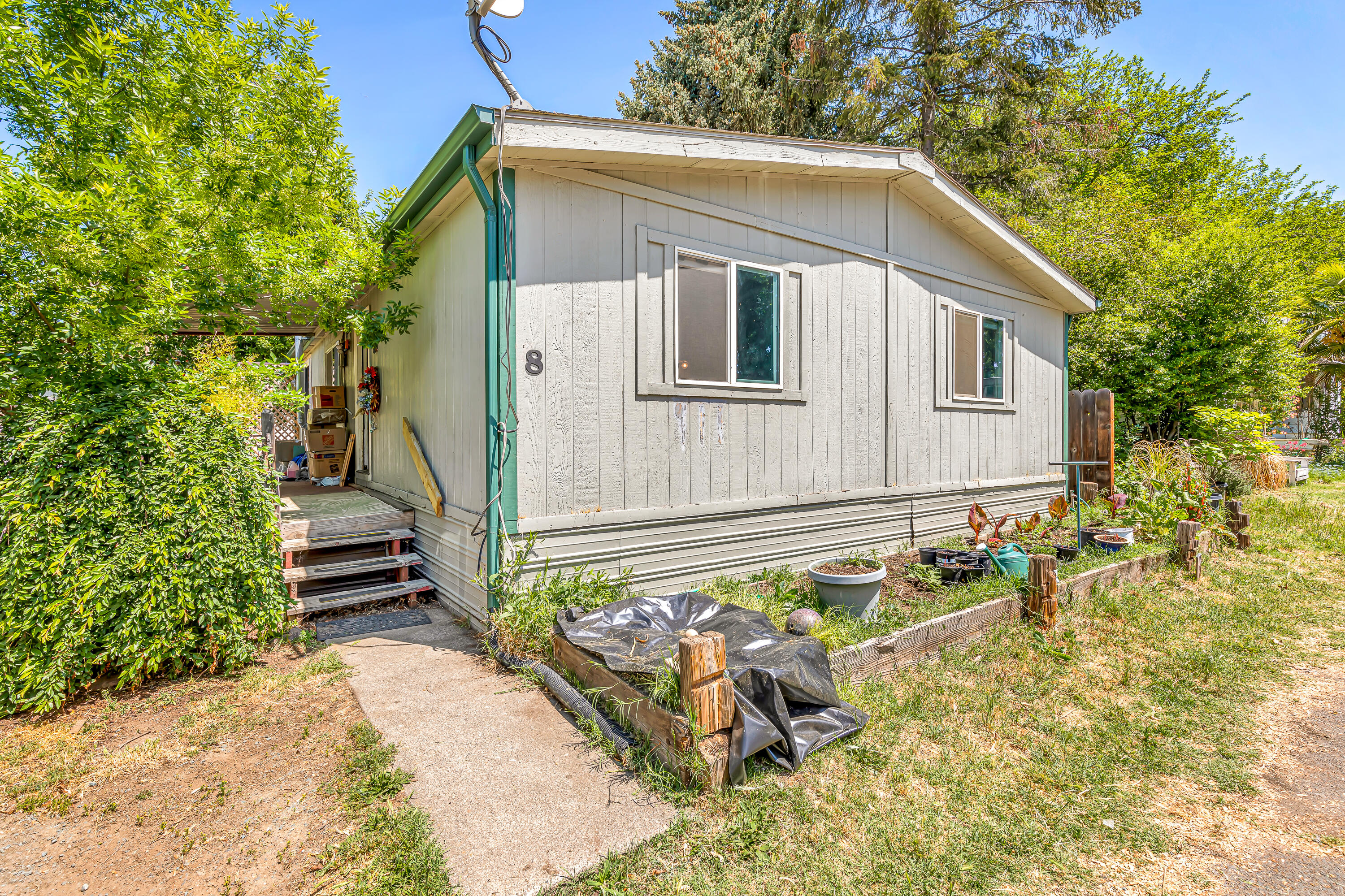 939 South Valley View Road, Unit 8 Ashland, OR 97520 - Photo 23 of 24 a front view of a house with garden