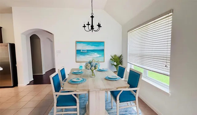 a view of a dining room with furniture and window