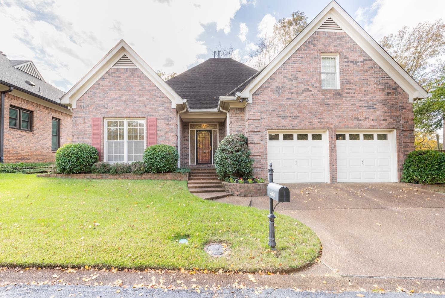 5359 Pavillion Green South Memphis, TN 38119 - Photo 1 of 26 View of front of property featuring a front yard and a garage