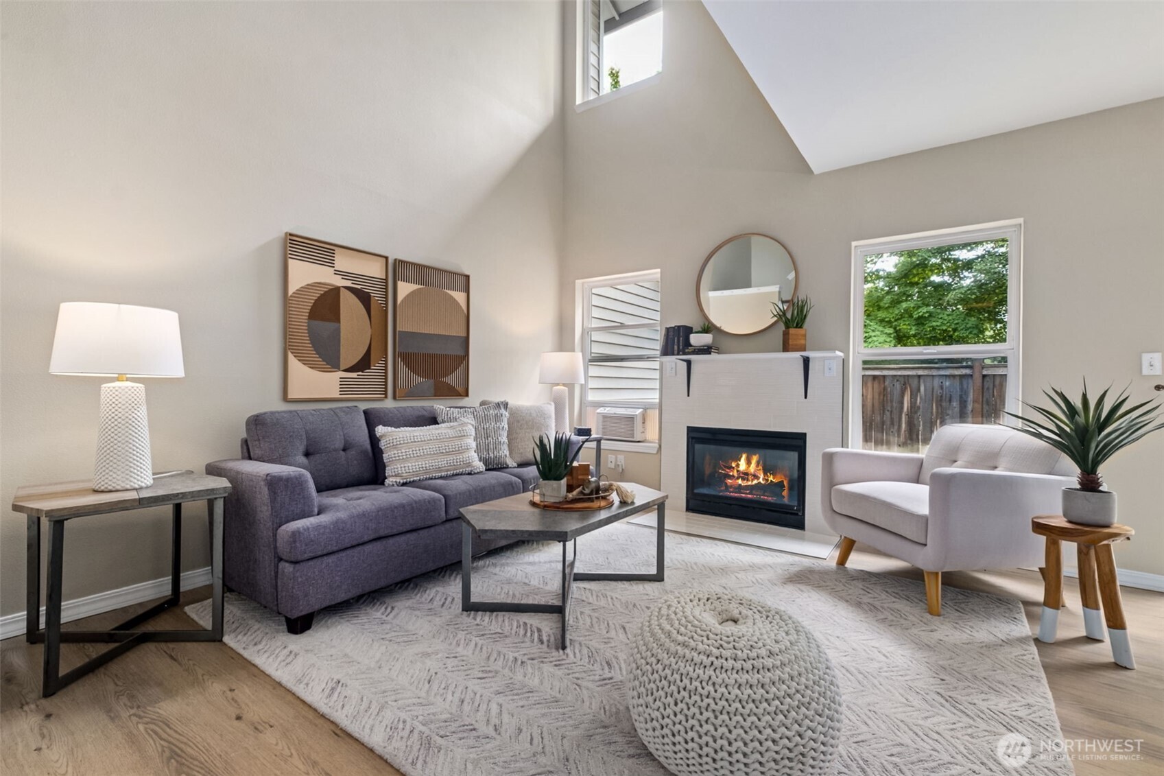 4808 Northeast Sunset Boulevard, Unit A102 Renton, WA 98059 - Photo 17 of 30 a living room with furniture and a fireplace
