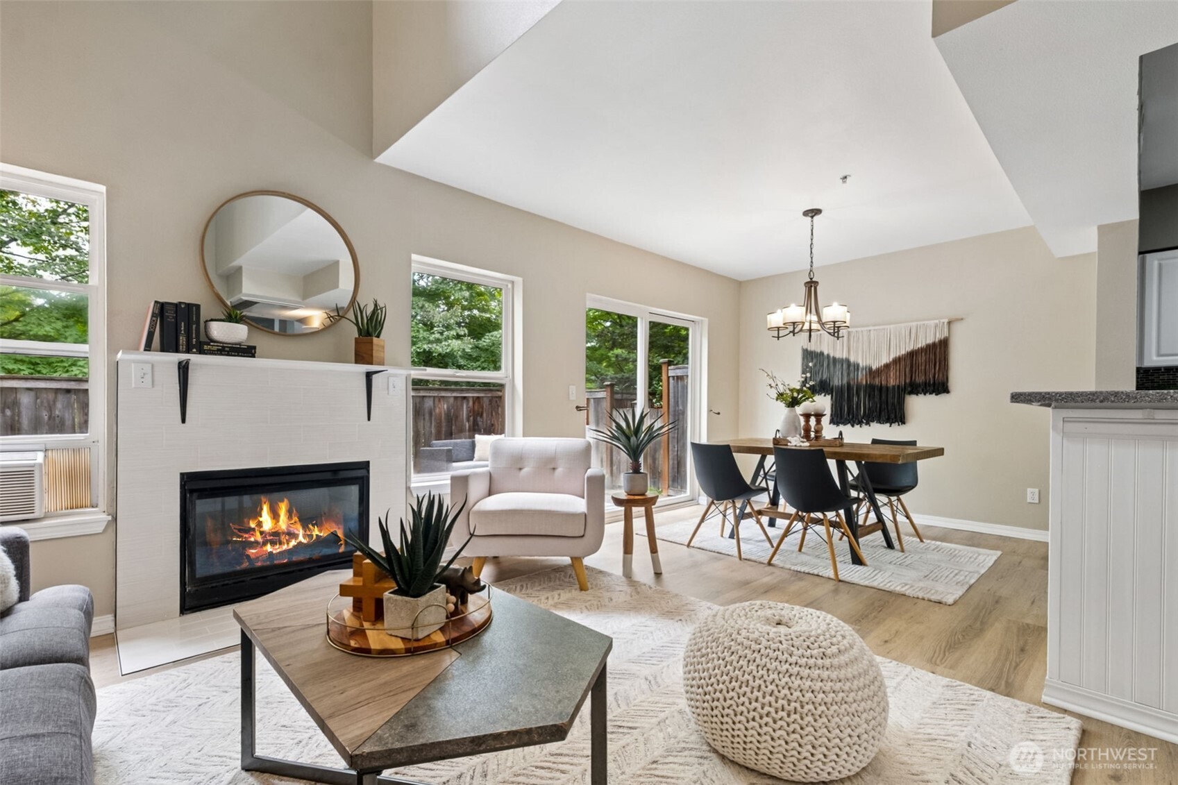 4808 Northeast Sunset Boulevard, Unit A102 Renton, WA 98059 - Photo 18 of 30 a living room with furniture a fireplace and a table