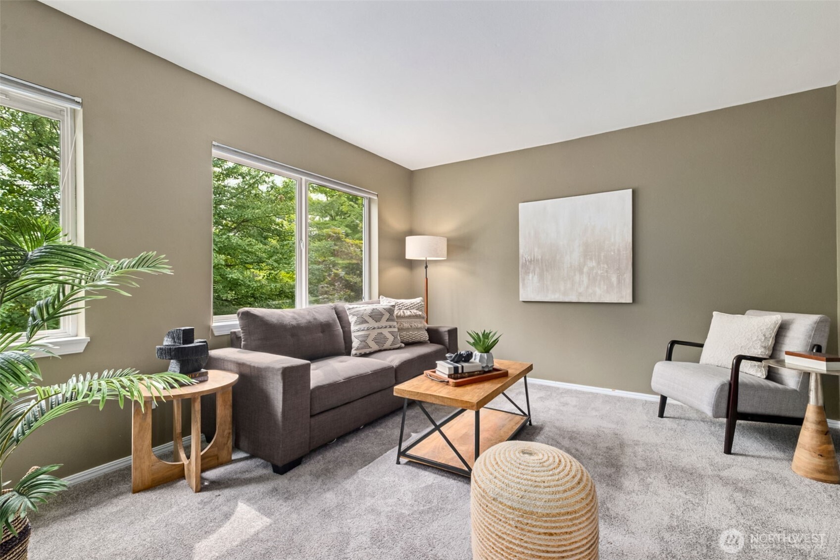 4808 Northeast Sunset Boulevard, Unit A102 Renton, WA 98059 - Photo 21 of 30 a living room with furniture and a large window