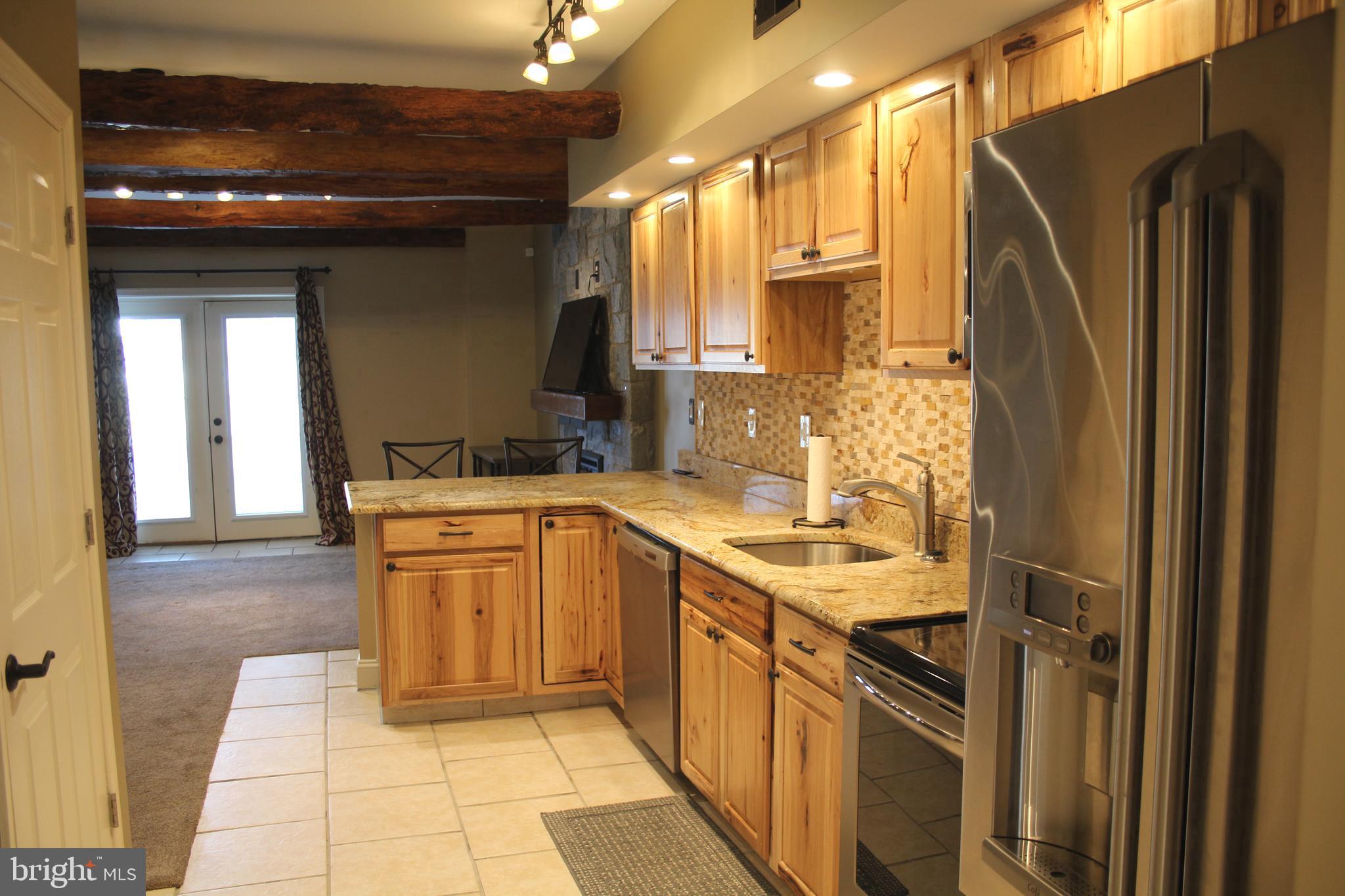 1152 South Valley Forge Road, Unit 1152 Norristown, PA 19403 - Photo 6 of 21 a kitchen with a sink refrigerator and cabinets