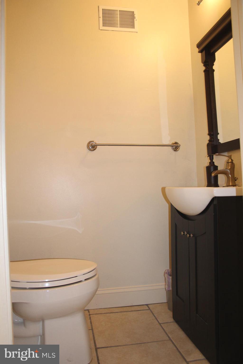 1152 South Valley Forge Road, Unit 1152 Norristown, PA 19403 - Photo 7 of 21 a bathroom with a sink a toilet and a mirror