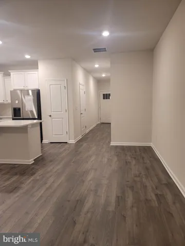 a view of kitchen with stainless steel appliances granite countertop refrigerator sink and stove