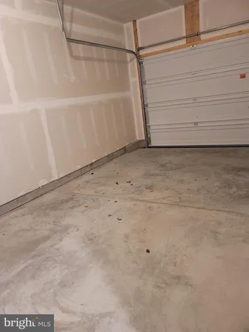 a white toilet sitting next to a shower