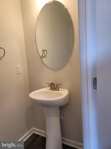 a view of gallery with wooden floor