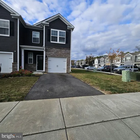 a view of a yard in front of a brick building