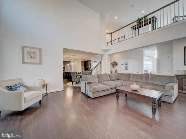 a spacious bedroom with a bed and ceiling fan