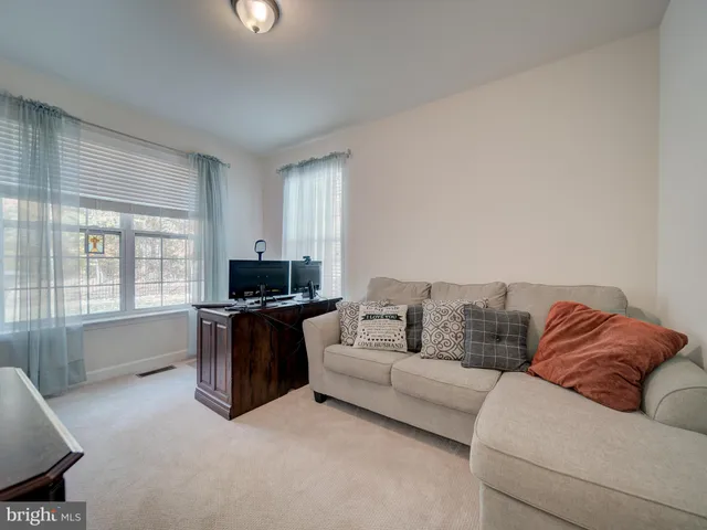 a bathroom with a tub double sink large mirror and vanity