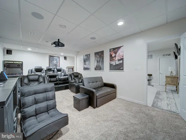 a view of a livingroom with furniture and a flat screen tv