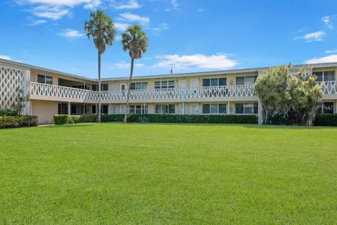 a view of an apartment with a swimming pool
