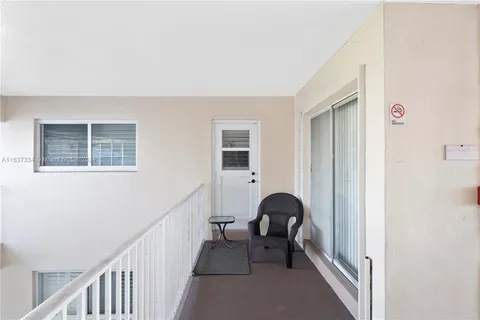 a view of a livingroom with furniture and staircase