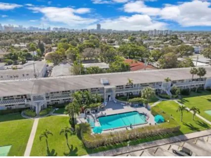 an aerial view of a house with a garden
