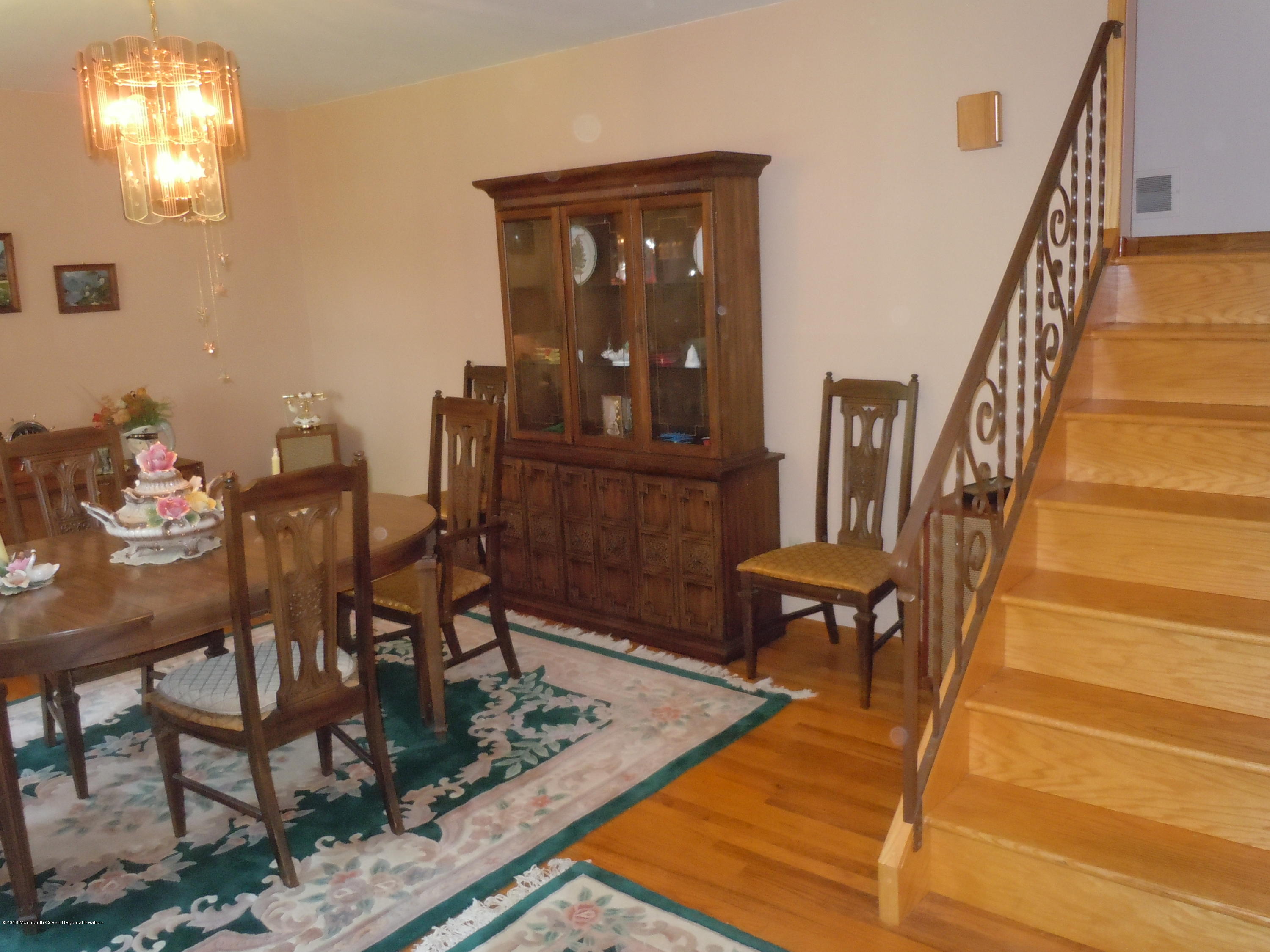 7 Peach Tree Road Oakhurst, NJ 07755 - Photo 15 of 36 a view of a dining room with furniture and a window