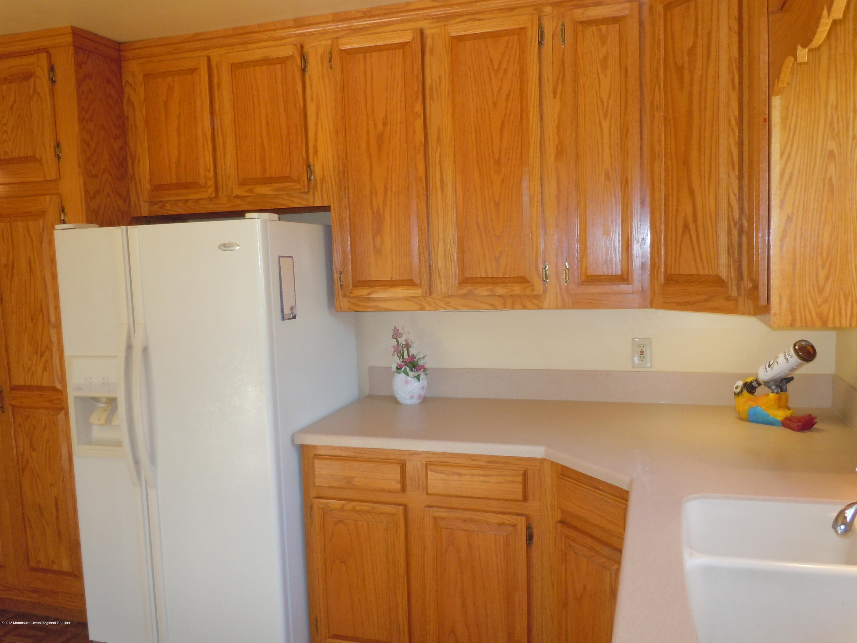 7 Peach Tree Road Oakhurst, NJ 07755 - Photo 24 of 36 a bathroom with a sink and a cabinet