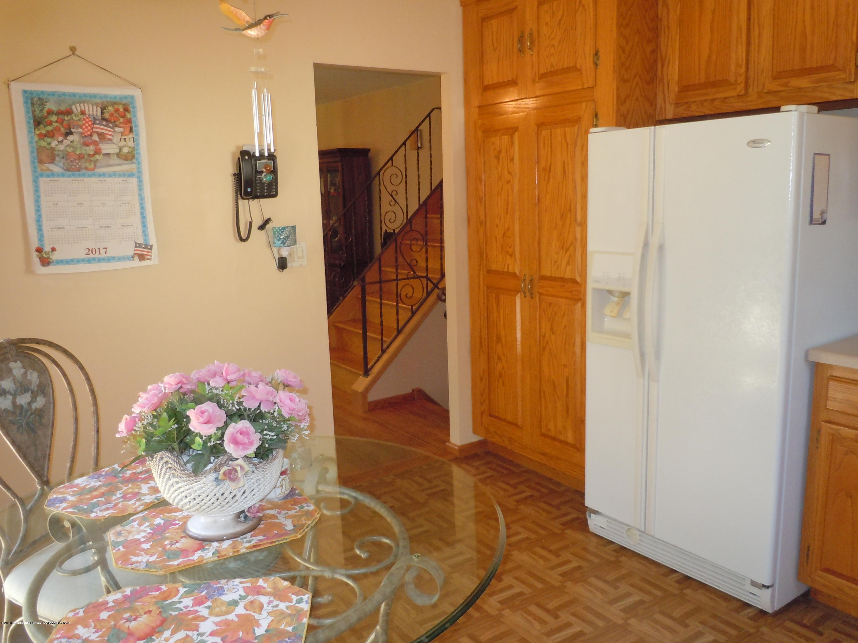 7 Peach Tree Road Oakhurst, NJ 07755 - Photo 25 of 36 a bathroom with a sink mirror and shower