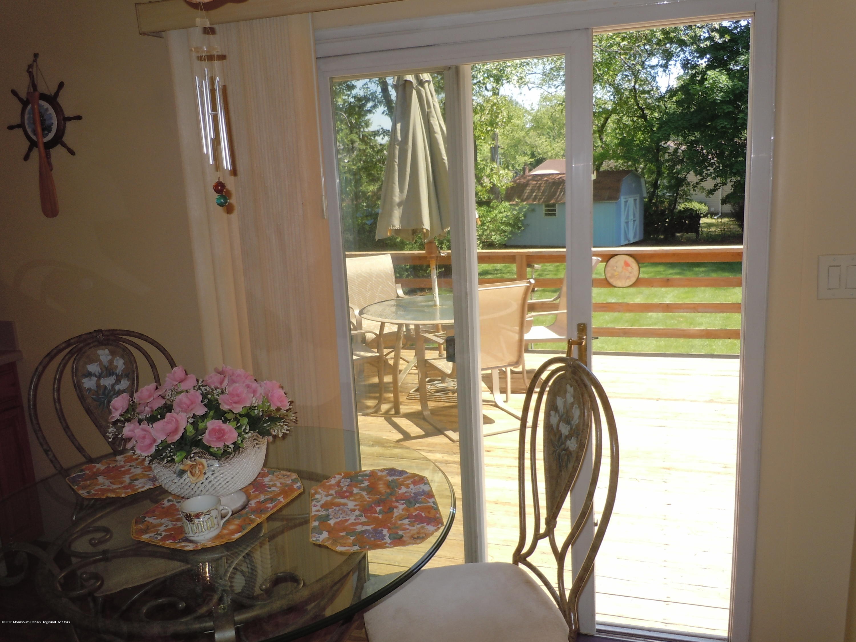 7 Peach Tree Road Oakhurst, NJ 07755 - Photo 27 of 36 a view of a dining room with furniture window and outside view