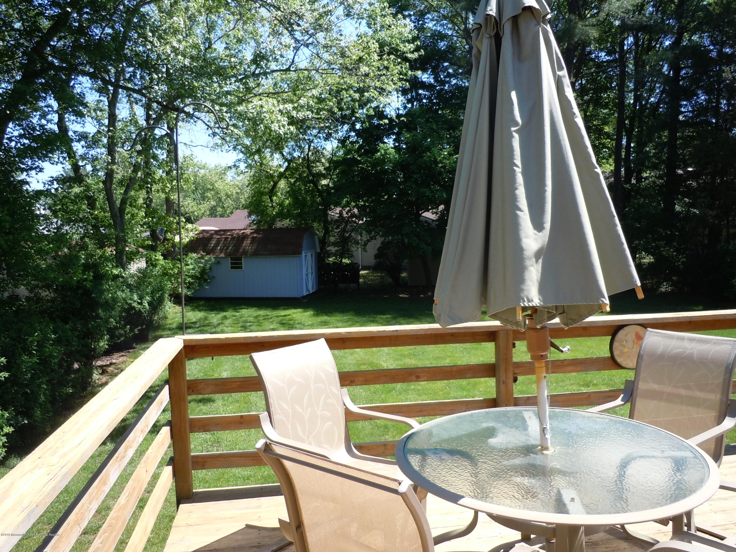 7 Peach Tree Road Oakhurst, NJ 07755 - Photo 29 of 36 a view of swimming pool with a patio