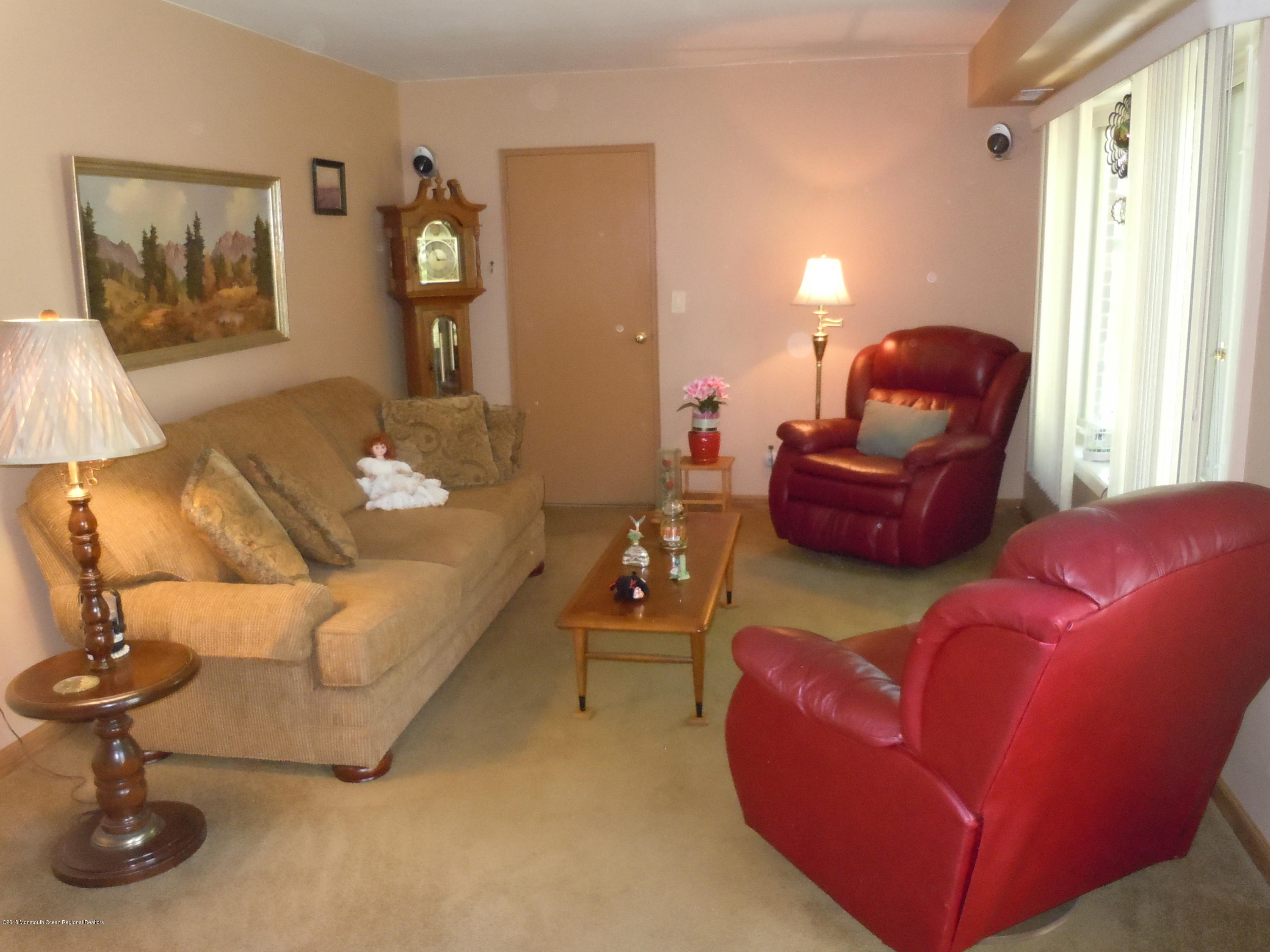 7 Peach Tree Road Oakhurst, NJ 07755 - Photo 3 of 36 a living room with furniture and a window