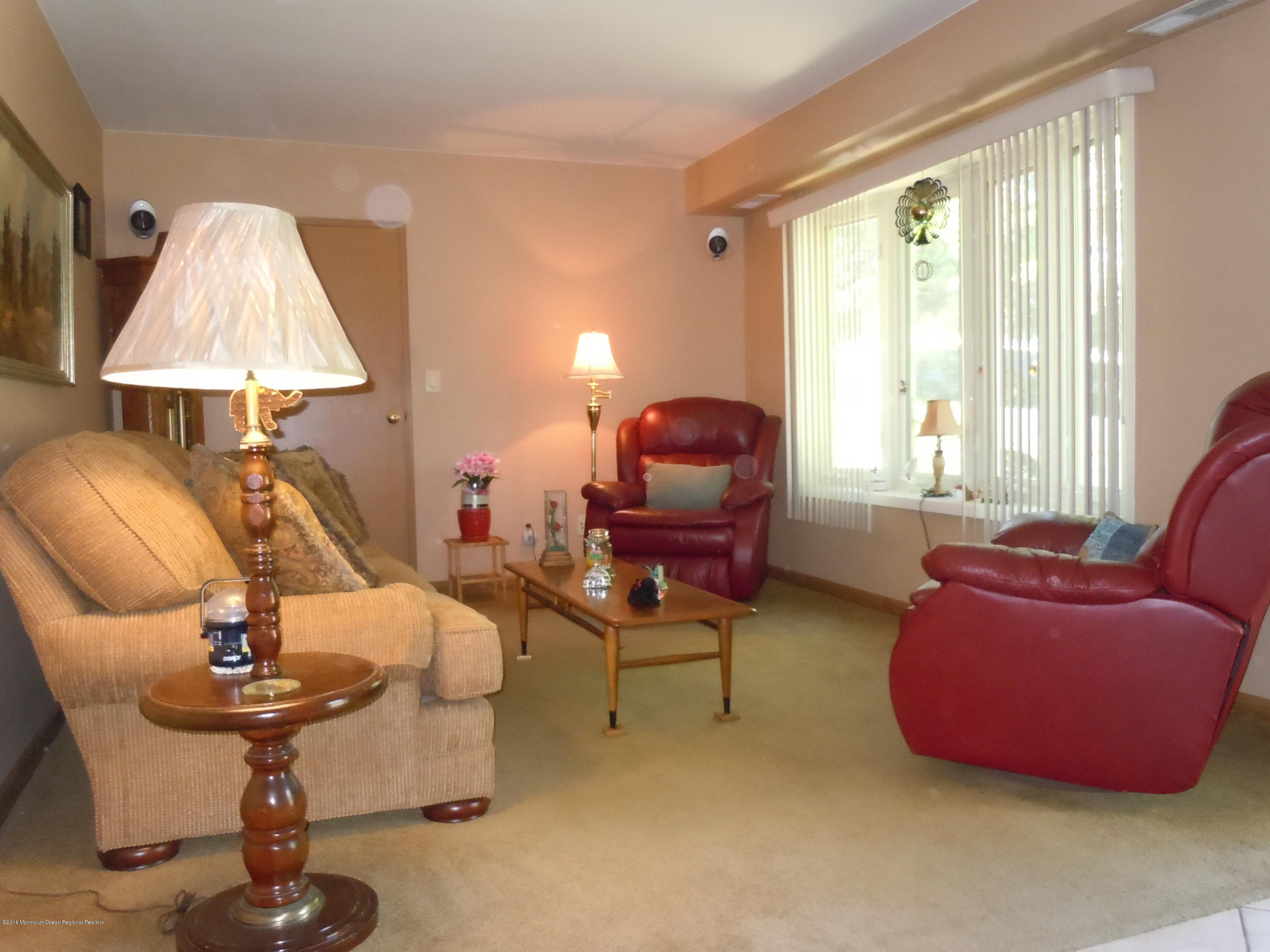 7 Peach Tree Road Oakhurst, NJ 07755 - Photo 4 of 36 a living room with furniture and a window