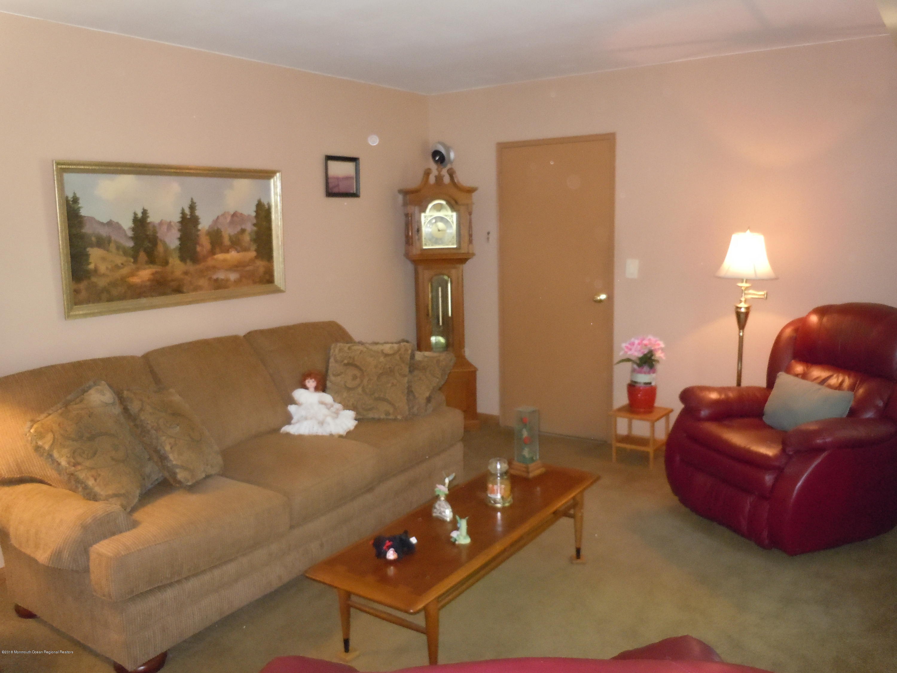 7 Peach Tree Road Oakhurst, NJ 07755 - Photo 5 of 36 a living room with furniture and wooden floor