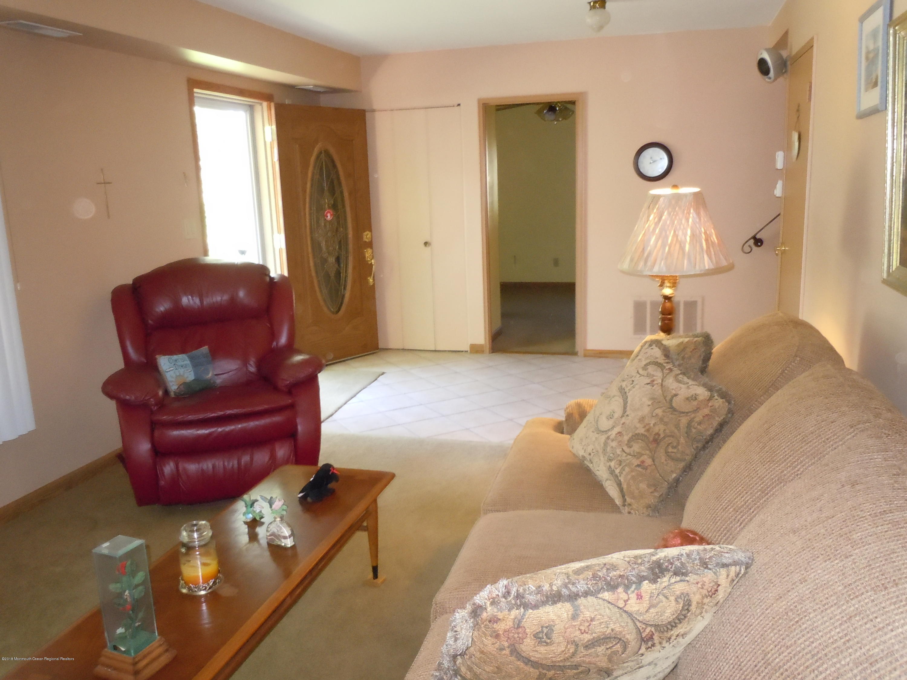 7 Peach Tree Road Oakhurst, NJ 07755 - Photo 6 of 36 a living room with furniture and a window