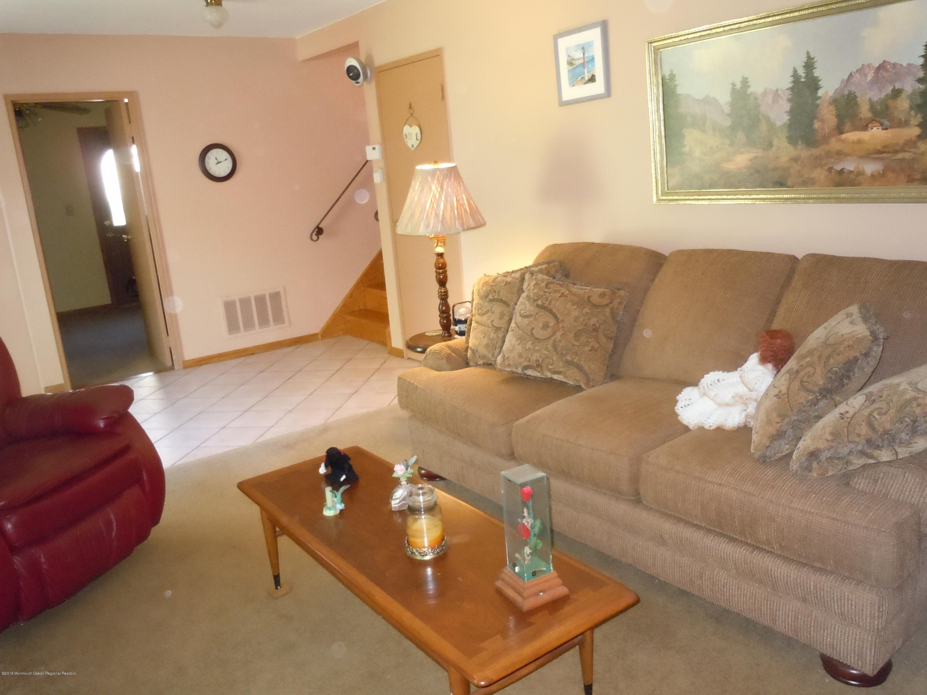 7 Peach Tree Road Oakhurst, NJ 07755 - Photo 7 of 36 a living room with furniture and a couch