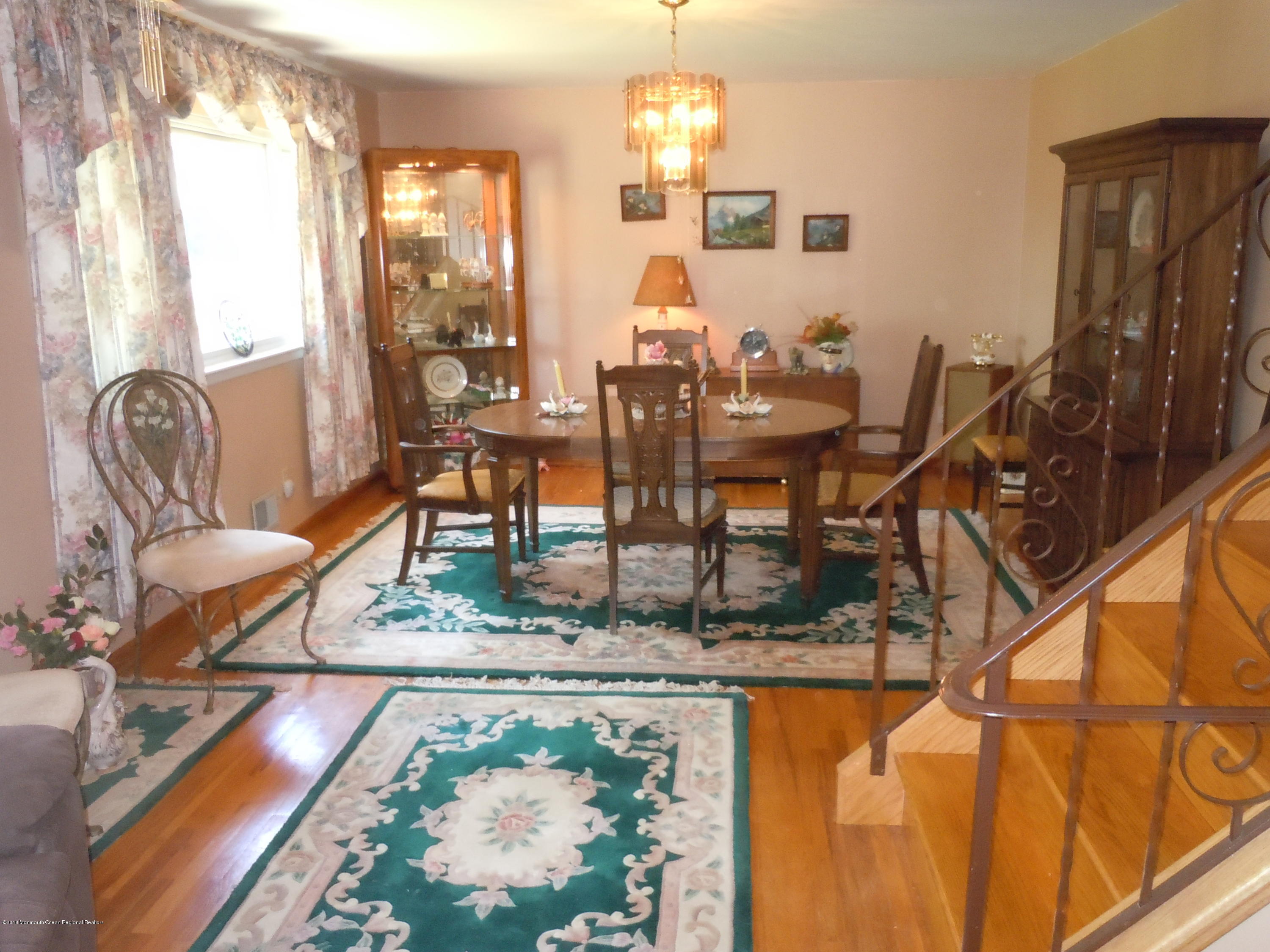 7 Peach Tree Road Oakhurst, NJ 07755 - Photo 10 of 36 a dining room with furniture and a floor to ceiling window