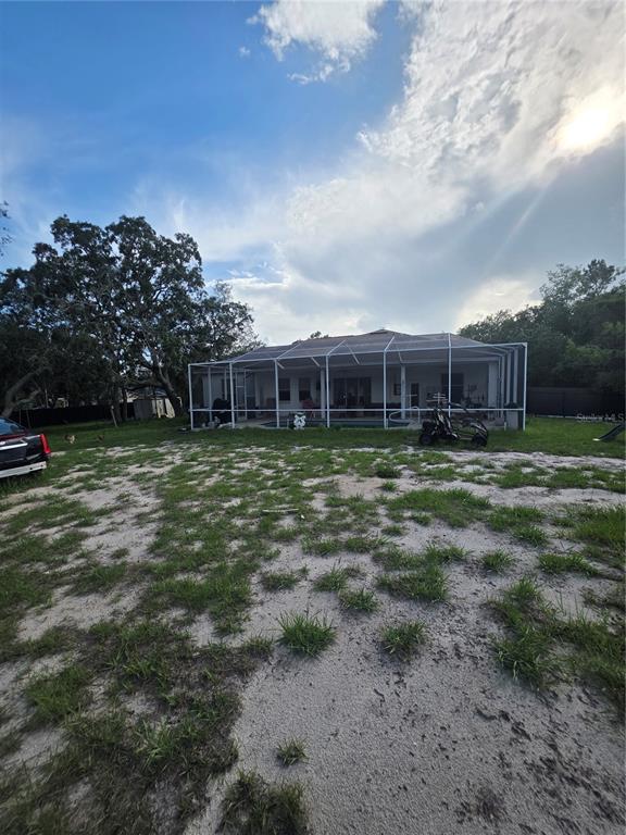 17820 Monteverde Drive Spring Hill, FL 34610 - Photo 35 of 42 a view of a house with a yard