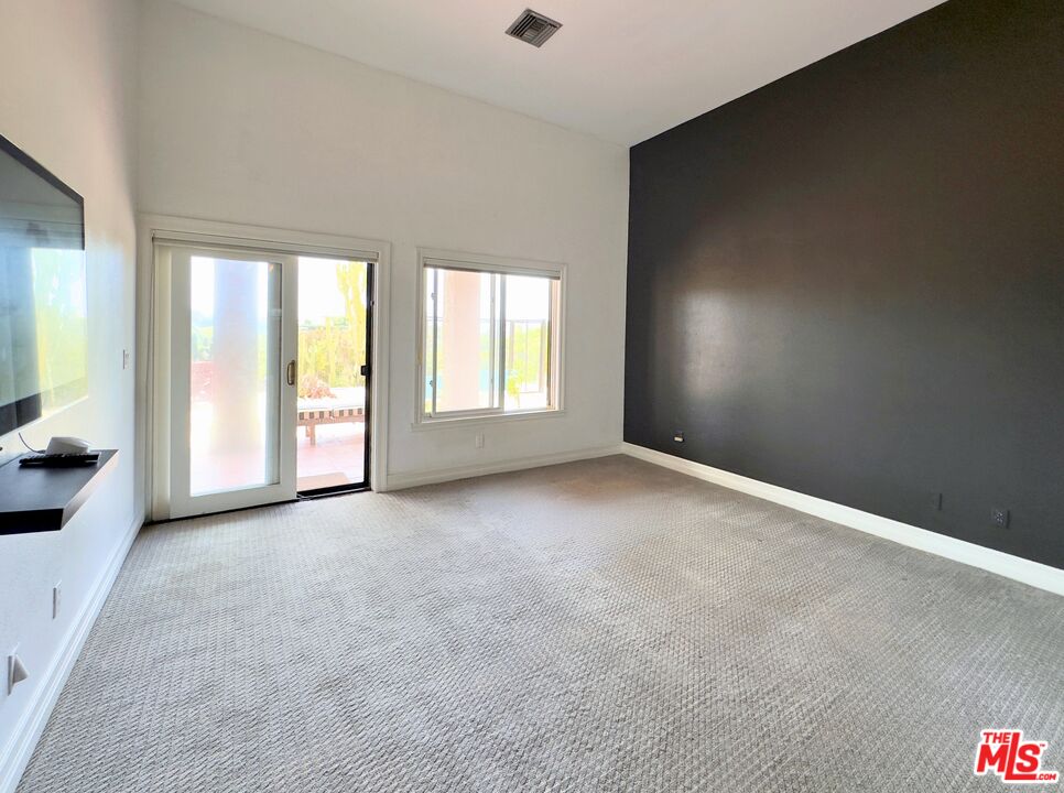 6140 Cavalleri Road, Unit GH Malibu, CA 90265 - Photo 12 of 24 an empty room with windows