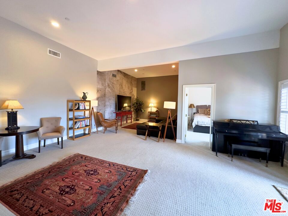 6140 Cavalleri Road, Unit GH Malibu, CA 90265 - Photo 2 of 24 a living room with furniture and a piano