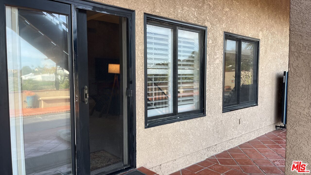 6140 Cavalleri Road, Unit GH Malibu, CA 90265 - Photo 3 of 24 a view of a glass door with a glass door