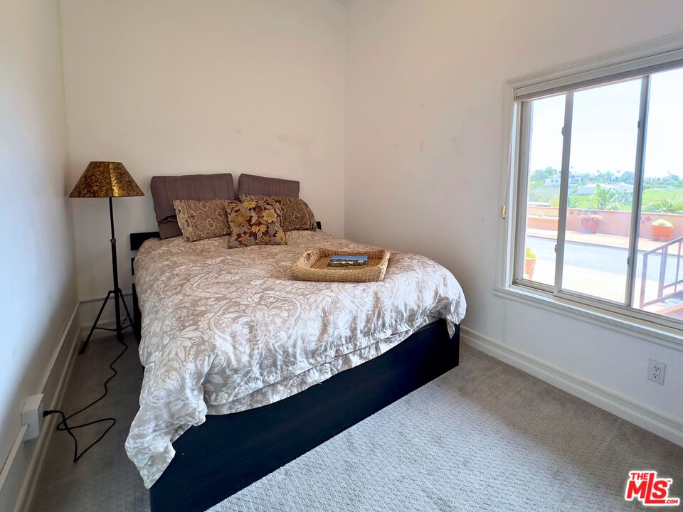 6140 Cavalleri Road, Unit GH Malibu, CA 90265 - Photo 9 of 24 a bedroom with bed and window