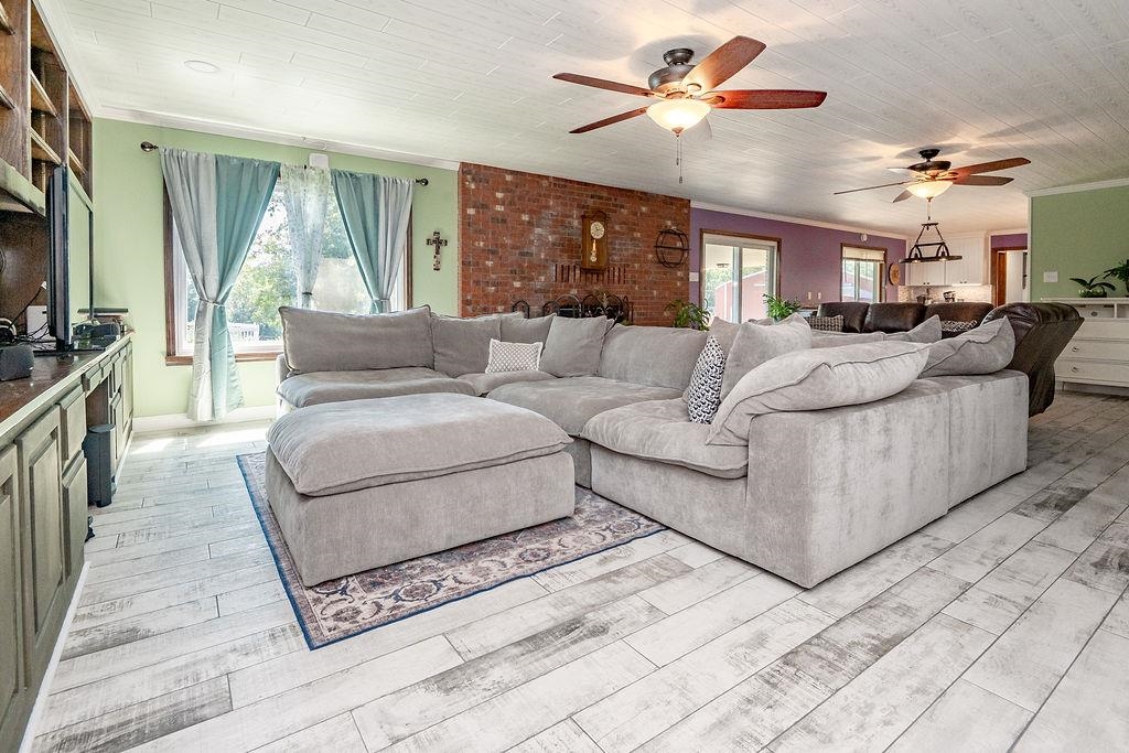 5870 Monk House Road Somerville, TN 38068 - Photo 11 of 40 a living room with furniture and a flat screen tv