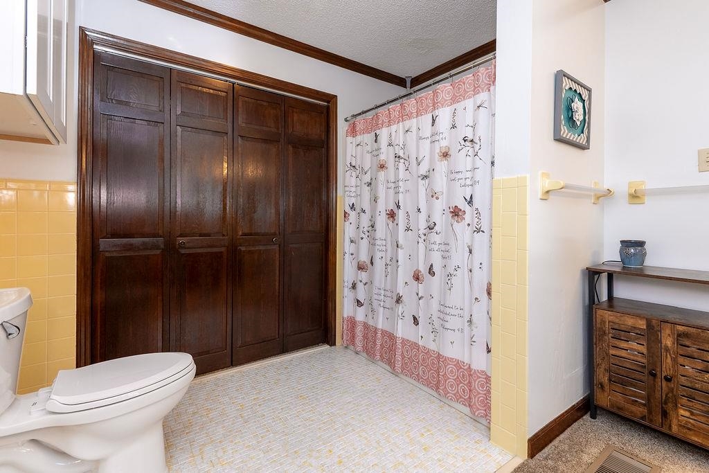 5870 Monk House Road Somerville, TN 38068 - Photo 22 of 40 a bathroom with a toilet and a shower