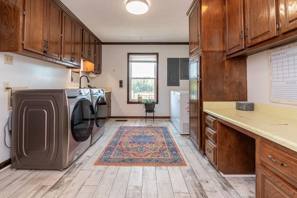 5870 Monk House Road Somerville, TN 38068 - Photo 32 of 40 a utility room with wooden floor washer and dryer