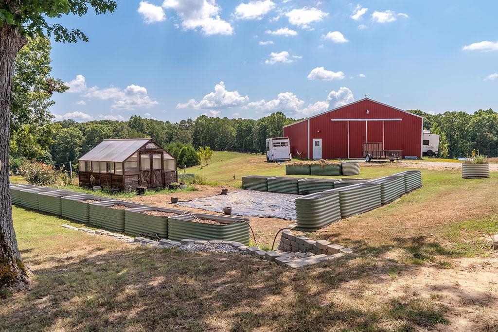 5870 Monk House Road Somerville, TN 38068 - Photo 5 of 40 a view of a house with a yard and sitting area
